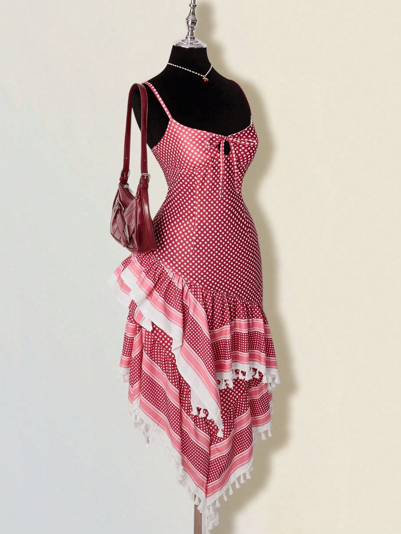 Step out in style with this Vintage Plaid Asymmetrical Ruffled Dress in vibrant red. Its playful hollow-out hem and charming ruffles add a flirty twist to classic plaid, making every move feel fun and fabulous. Perfect for turning heads at any occasion!