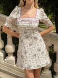 Step into charm with this Vintage Purple Ditsy Floral A-Line Mini Dress. Featuring delicate lace panels and a cinched waist, it effortlessly blends retro vibes with a flirty silhouette. Perfect for twirling through sunny days or adding a playful touch to your evening look.