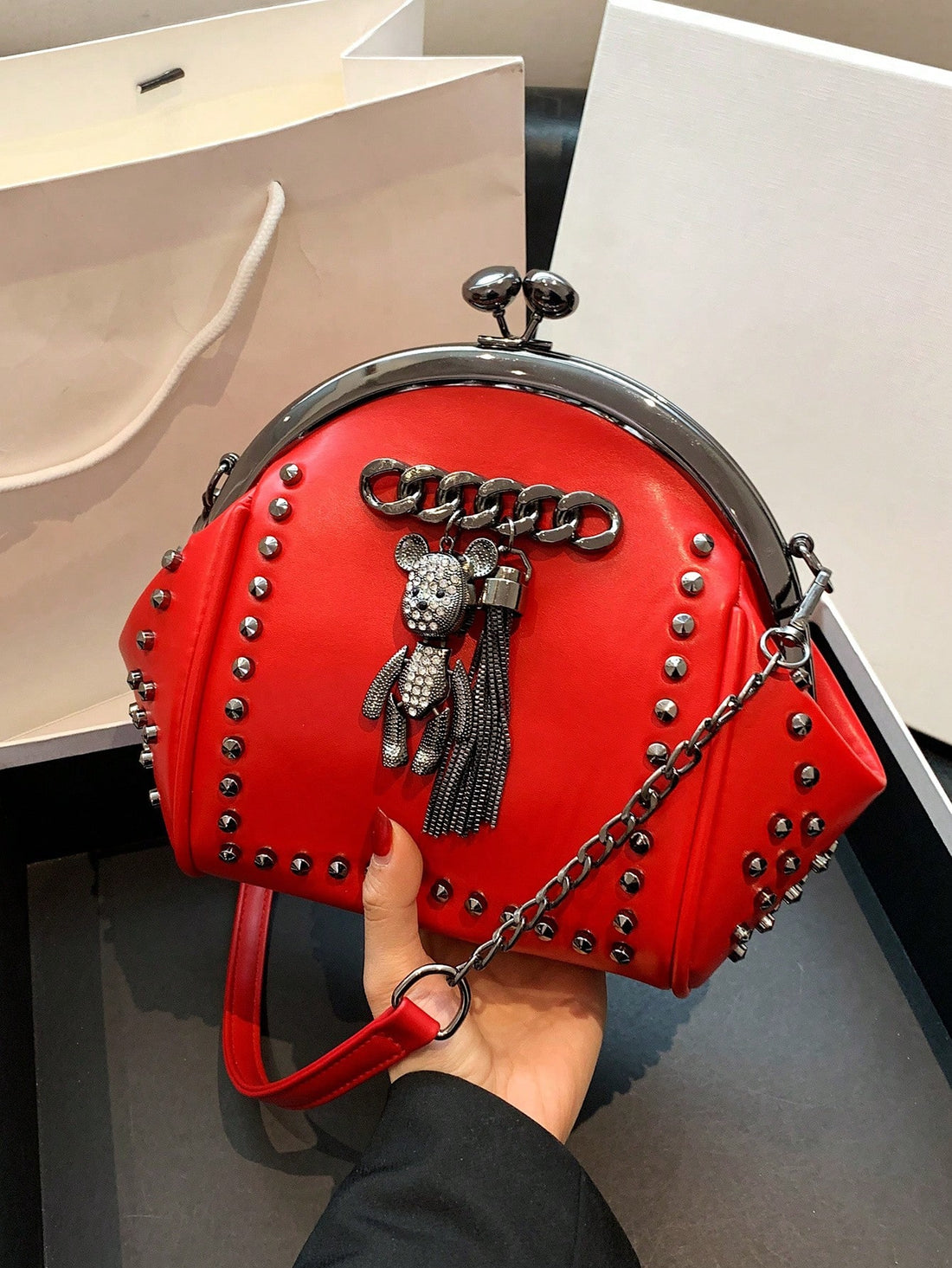Add a touch of vintage style to your outfit with our Vintage Rivet Fringe Shoulder Bag. Made with stylish crossbody chain and adorned with rivet fringe, this bag is perfect for any fashion-forward individual. Keep your essentials close and add an edge to your look with this versatile handbag.