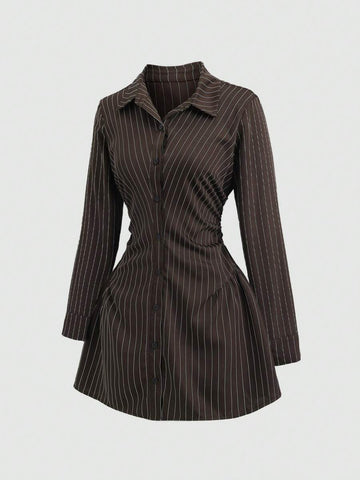 Front three-quarter view of brown pinstripe long-sleeve shirt mini dress with ruched waist