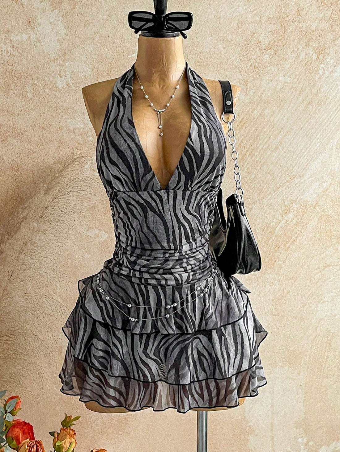 Make a bold statement with this eye-catching vintage tie-dye zebra print mini dress! Featuring a flattering V-neckline and playful color-blocked design, it's the perfect piece to channel retro vibes with modern flair. The relaxed fit works beautifully for casual outings or dressed-up occasions, while the mini length keeps things fun and flirty. Layer it with tights and boots for cooler months, or go solo when the weather warms up. A versatile wardrobe essential that brings personality and nostalgia to any o