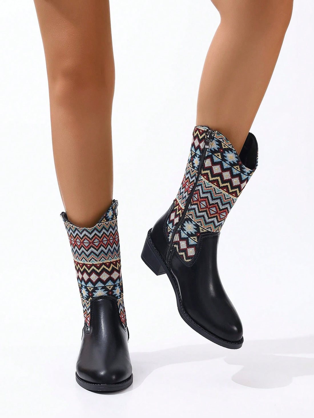 Experience a vintage vibe with our Embroidered Chunky Heel Mid-Calf Riding Boots. With intricate embroidery and a sturdy heel, these boots offer comfort and style for all-day wear. Elevate your wardrobe with this timeless addition.