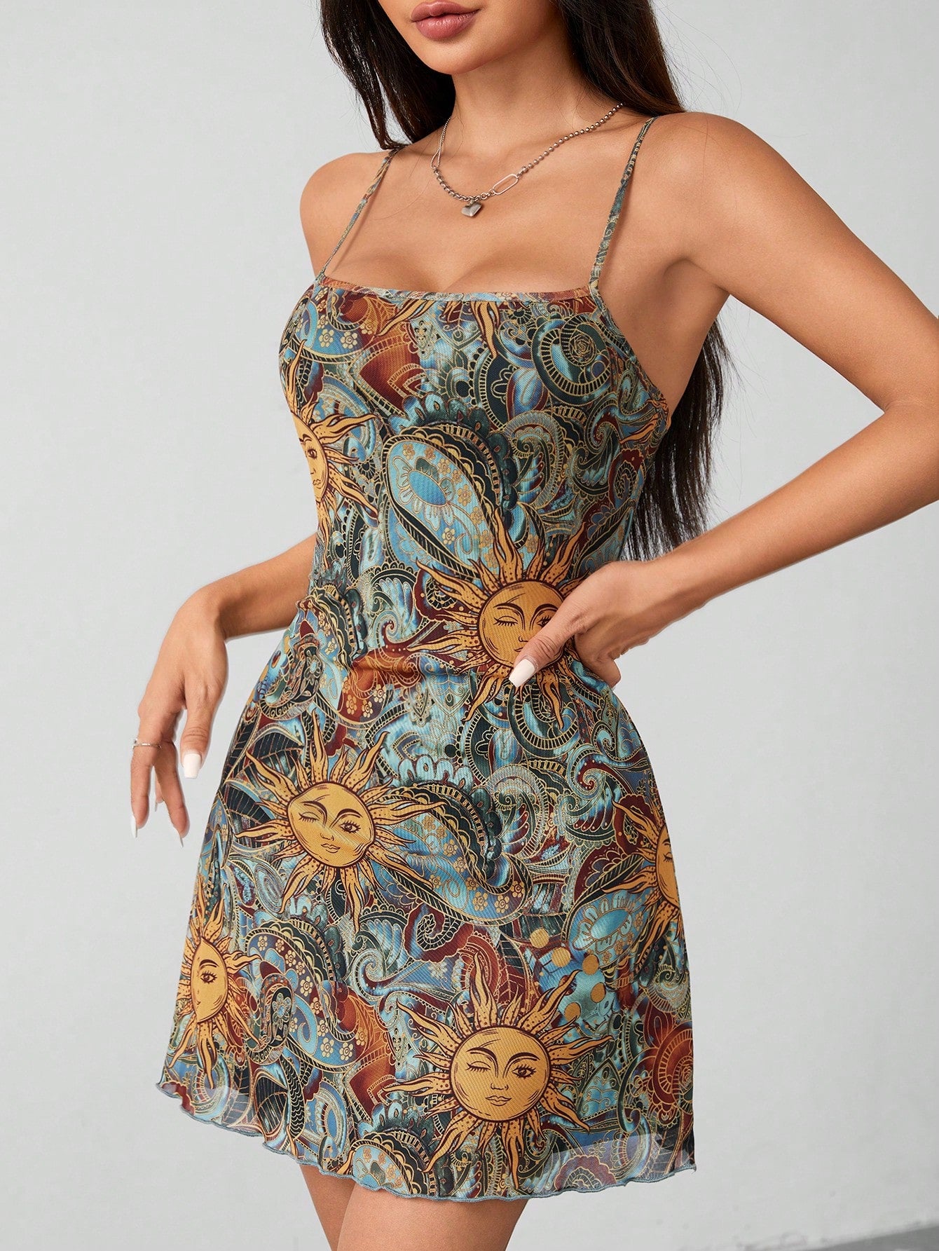 Experience a blast from the past with our Vintage Vibes: Retro Sun Face Print Spaghetti Strap Sundress. With its unique and funky sun face print, this dress is perfect for those who love retro fashion. The lightweight and airy design, along with the adjustable spaghetti straps, make it the perfect choice for any summer outing.