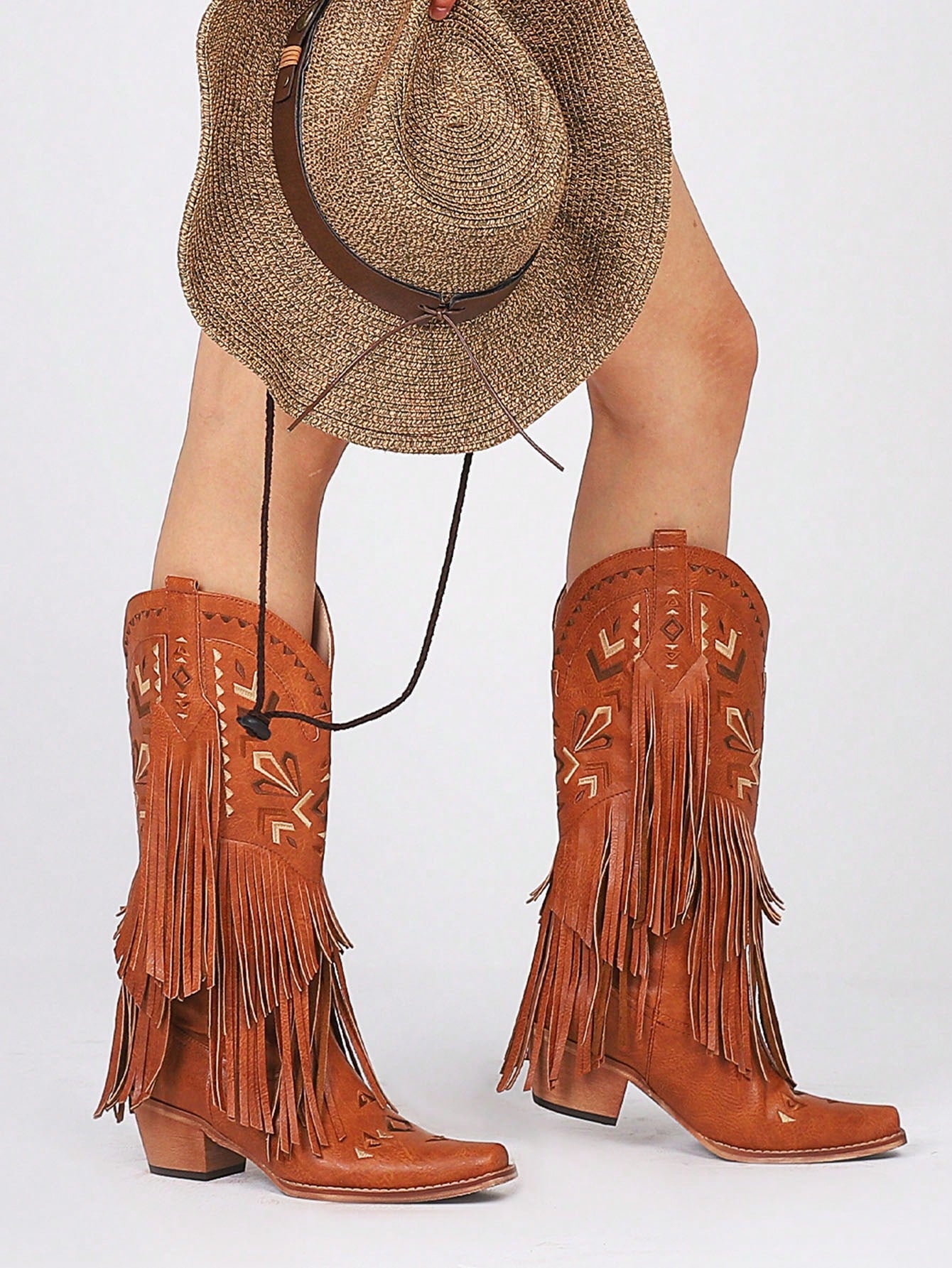 Experience the perfect blend of style and durability with our Vintage Western Fringe Cowgirl Boots. Made for women, these boots feature a stylish vintage design and sturdy construction, ensuring long-lasting wear. Elevate your western look with these timeless boots.