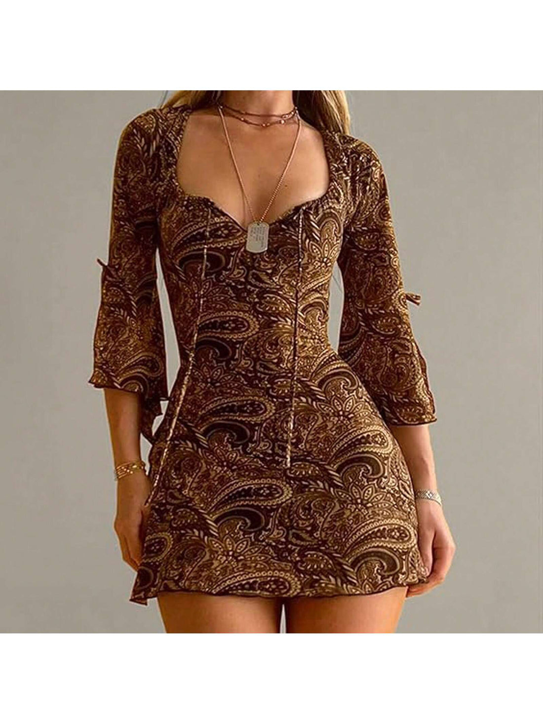 Step into summer with elegance in this Vintage Y2K Mini Dress. The flared sleeves and tie-up slit add a touch of sophistication, while the vintage design adds a fun twist. Perfect for any occasion, this dress will have you feeling stylish and confident.