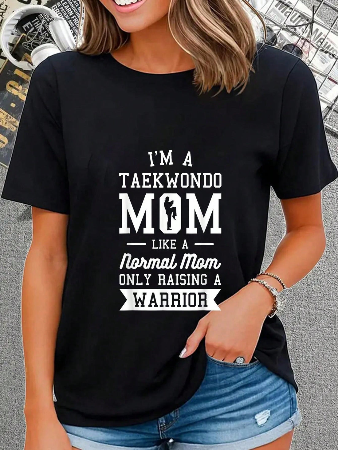 Unleash your inner warrior mom with this graphic tee! Featuring the phrase "Taekwondo Spirit" and a fierce martial arts design, this shirt is perfect for proud parents of martial artists. Show off your family's taekwondo pride with style and a bit of humor. Namaste, mamas!