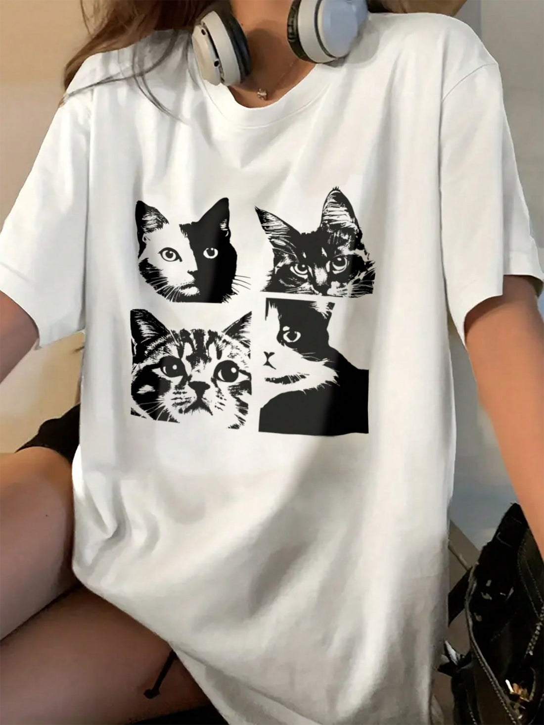 Unleash your inner cat lover with our Whimsical Cat Vibes Drop Shoulder T-Shirt. Made with a comfortable and stylish drop shoulder design, this t-shirt is perfect for any feline enthusiast. Show off your love for cats with this fun and unique shirt.