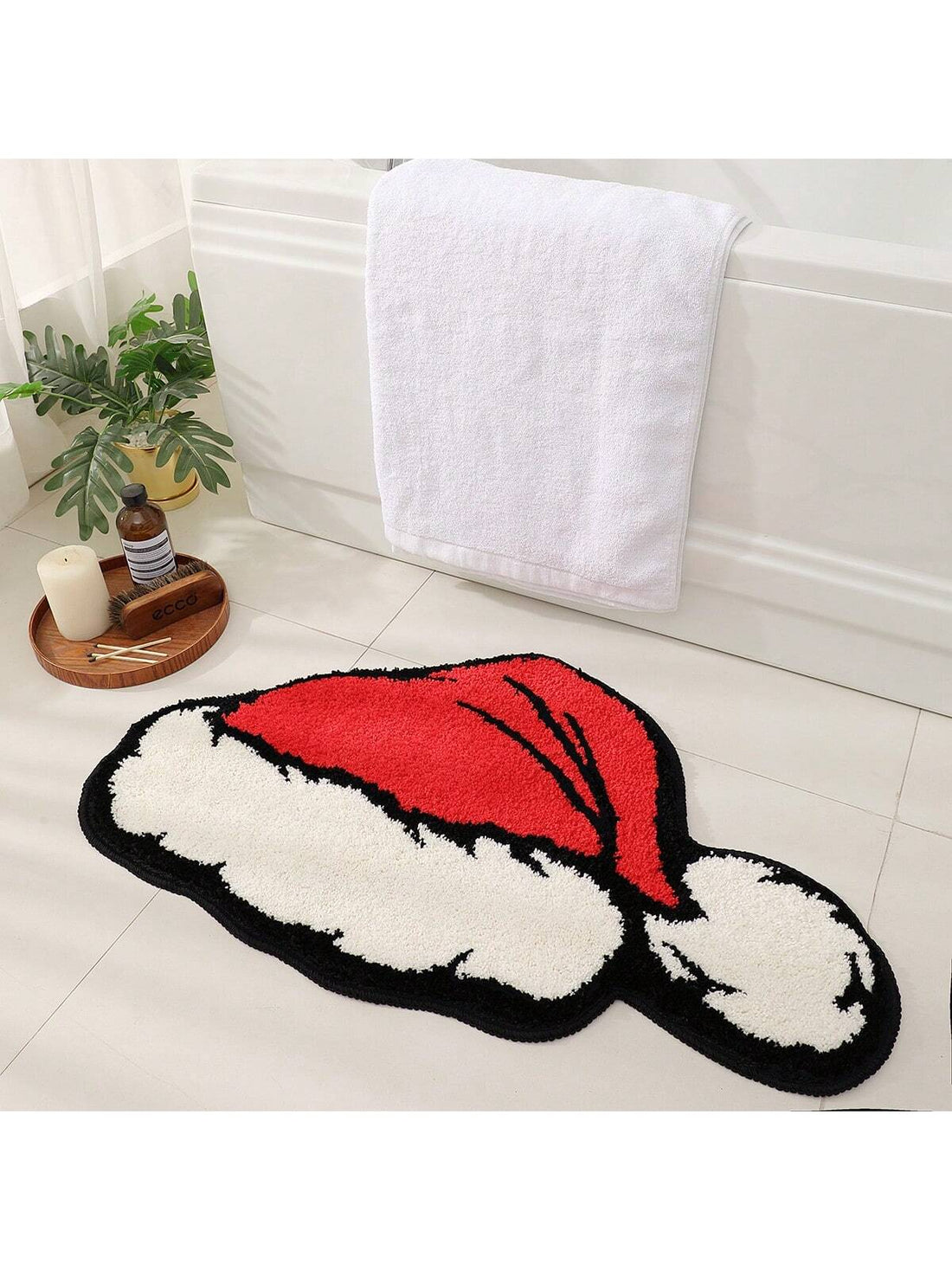 Transform your bathroom into a festive wonderland with our Whimsical Christmas Cap Bath Rug. Made with plush material, it offers comfort and warmth for your feet. The non-slip backing ensures safety, while its washable design makes it easy to maintain. Elevate your holiday bathroom decor with this charming rug.
