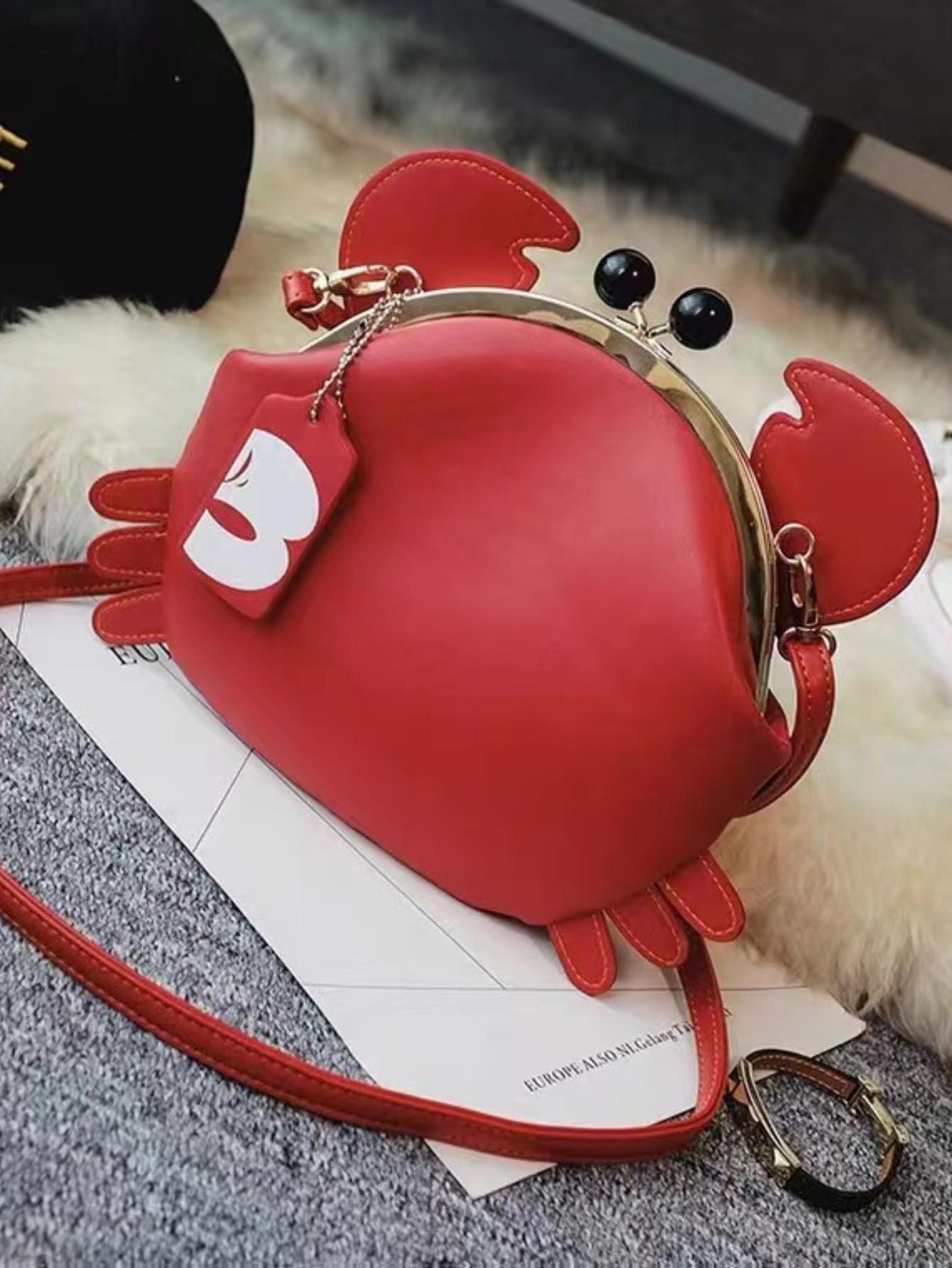 Crabaliciously cute! This Whimsical Crab bag is a playful addition to any outfit. Its kiss-lock feature adds a unique touch while the crossbody strap offers practicality. Perfect for adding a little fun to your style, this bag is sure to turn heads and make you stand out from the crowd.