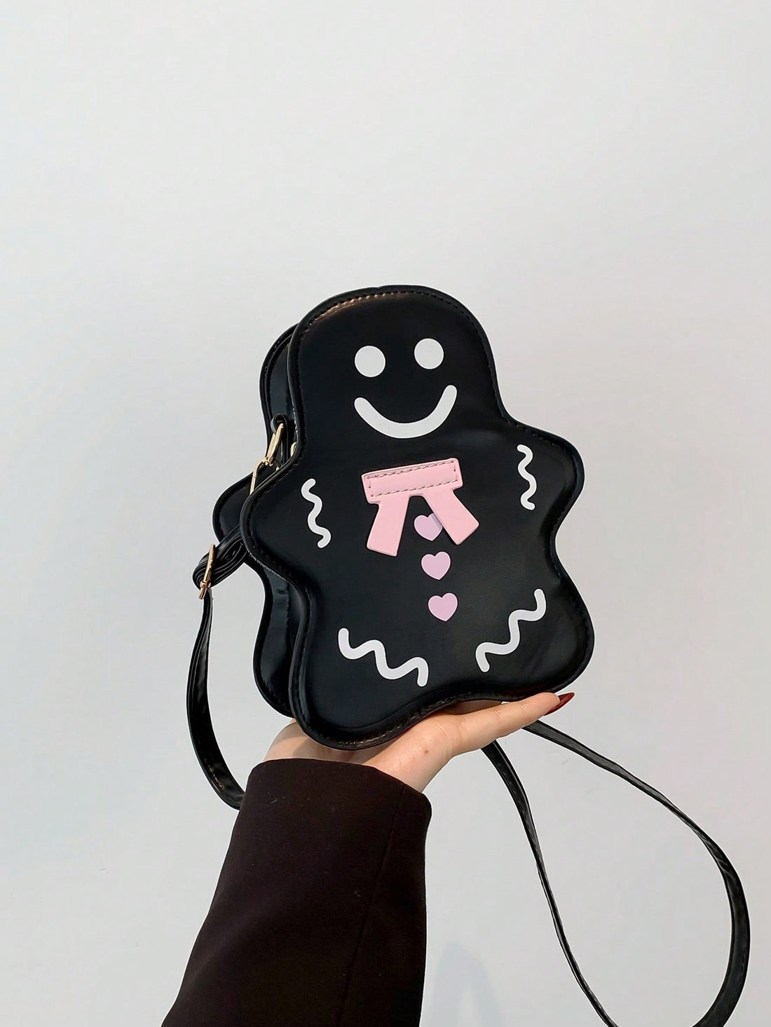 Add some whimsical charm to your style with our Whimsical Gingerbread Man PU Leather Shoulder Bag! Crafted with high-quality materials, this bag is not only perfect for Halloween, but also makes a unique and thoughtful gift. With its spacious design and durable construction, it's the perfect accessory for any occasion.
