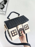 This Whimsical House Handheld Shoulder Bag is the perfect accessory for any fashion-forward individual. Its playful design features a charming pink and white color combination, adding a touch of whimsy to any outfit. With its convenient handheld and shoulder strap options, this bag offers both style and functionality. Add a touch of whimsy to your wardrobe with this one-of-a-kind bag.