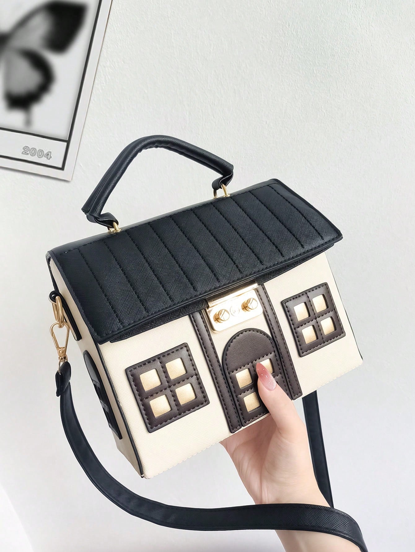 This Whimsical House Handheld Shoulder Bag is the perfect accessory for any fashion-forward individual. Its playful design features a charming pink and white color combination, adding a touch of whimsy to any outfit. With its convenient handheld and shoulder strap options, this bag offers both style and functionality. Add a touch of whimsy to your wardrobe with this one-of-a-kind bag.