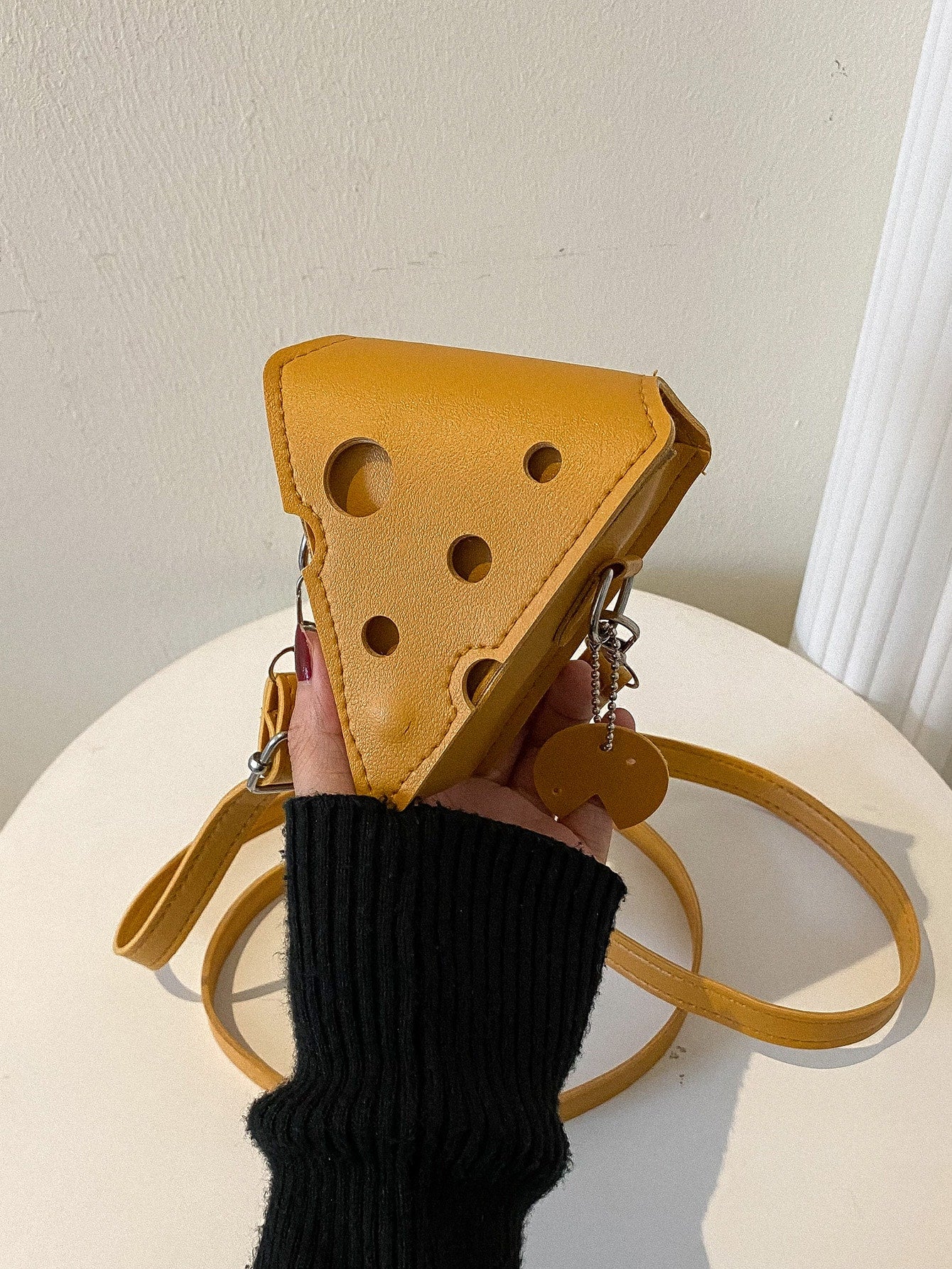 This Whimsical Mini Cheese Novelty Bag is the perfect gift for any cheese lover. With its unique design and playful character, it's sure to bring a smile. Made from high-quality materials, it's durable and practical. Get ready to add a touch of whimsy to your cheese-loving friend's life!