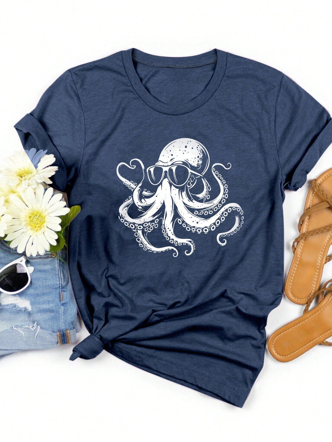 Get ready for some playful style with our Whimsical Octopus Graphic Tee! This casual short sleeve top is perfect for spring and summer, featuring a quirky octopus graphic that adds a touch of fun to any outfit. Express your unique sense of style with this must-have addition to your wardrobe.