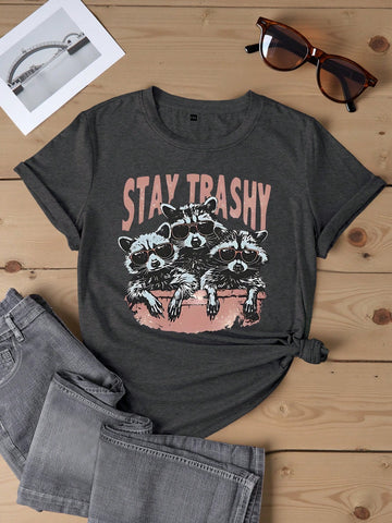 Get your playful summer look with our Whimsical Raccoon Graphic Tee! Featuring a quirky, fun design and a playful slogan, this tee will add a touch of whimsy to any outfit. Perfect for those who don't take themselves too seriously. (Plus, it's perfect for any animal lovers out there!)