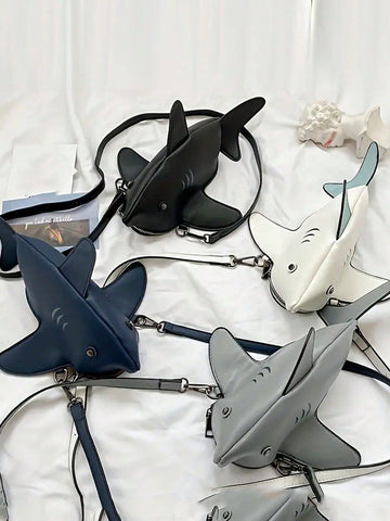 Add some bite to your style with this Whimsical Shark Crossbody Bag! This playful and trendy bag features a cute stuffed animal design that will surely make a splash. Perfect for any fashion-forward woman, this quirky bag is a must-have accessory. Get ready for jaws to drop wherever you go!