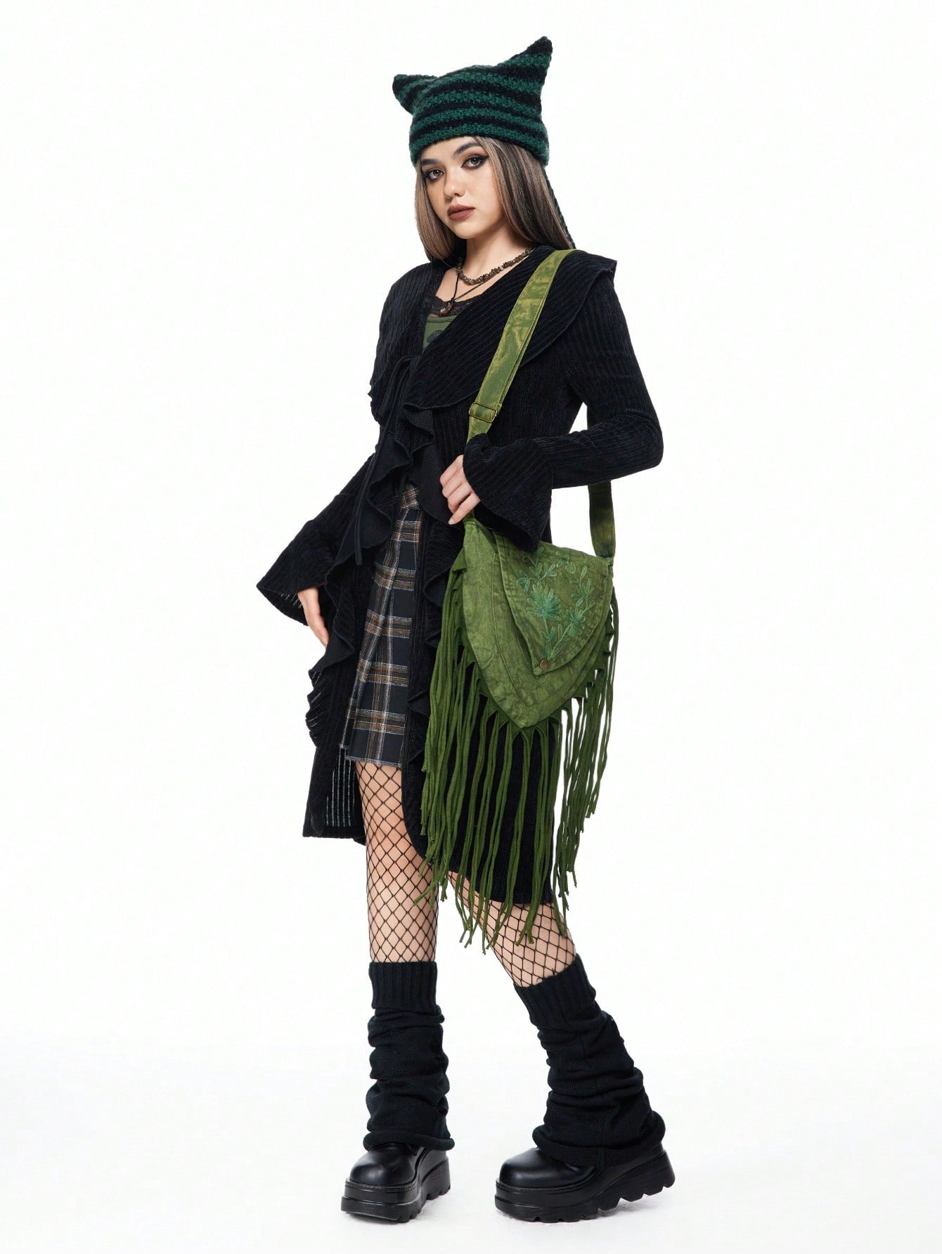 Elevate your festival fashion with our Whimsical Wanderer Fringe Crossbody Bag! Its fairycore meets grunge style is perfect for music festivals. With ample storage space and a funky fringe design, this bag is both stylish and functional. Become the ultimate wanderer with this must-have accessory!