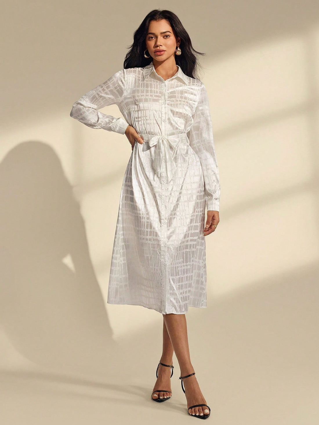 Elevate your seasonal wardrobe with this stunning white geometric jacquard dress! Featuring intricate patterned detailing and cozy long sleeves, it's the ultimate go-to piece for breezy spring days and crisp autumn afternoons. The relaxed silhouette keeps things effortlessly chic while the timeless white base pairs beautifully with everything in your closet. Whether you're running errands or meeting friends for coffee, this dress strikes the perfect balance between comfortable and put-together. A versatile 