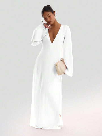 This white sheer maxi dress brings effortless summer vibes with its textured fabric and breezy wide sleeves. The side split adds a flirty touch, perfect for vacation days or sunny holiday strolls. Light, airy, and playful, it’s your go-to for stylish warm-weather adventures.