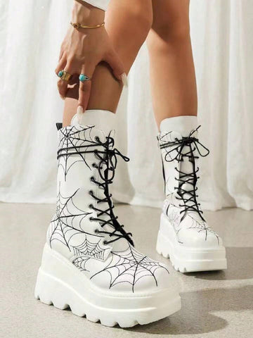 These White Spider Embroidered Thick-Soled Boots are the perfect combination of fashion and function. With a stylish high heel design and mid-calf length, these boots will elevate any outfit. The thick-soled construction provides superior comfort and stability, making these boots ideal for all-day wear. Step out with confidence and style in these must-have boots for women.