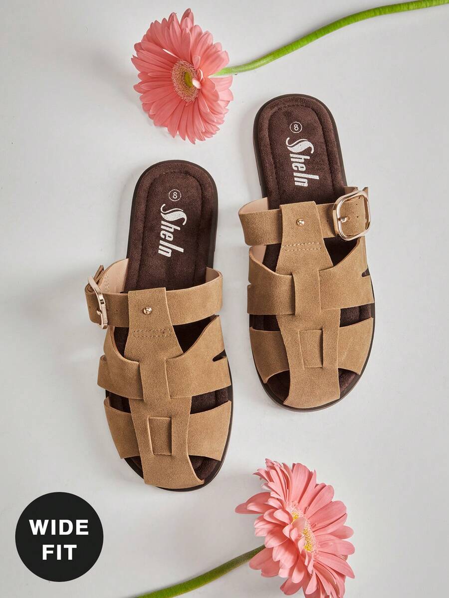 Enjoy effortless comfort and timeless style with these Wide Fit Fisherman Slide Sandals for Women. Designed with a roomy wide-fit silhouette and crafted in soft vegan suede, these sandals provide the perfect combination of everyday comfort and modern versatility. The classic fisherman-inspired design is updated with an adjustable buckle, giving you a secure, customized fit while maintaining a clean, minimalist look.