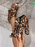Introducing Wildly Chic's Leopard Print Peep Toe Ankle Boots, featuring a high block heel for added elevation. Stay on trend and add a touch of fierce style to any outfit with these statement boots. Perfect for any occasion and sure to make a bold fashion statement.