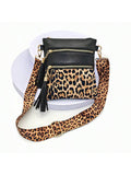 Experience fierce fashion with our Wildly Chic Leopard Print Tassel Crossbody Bag - your go-to statement piece for any outing! Featuring a stylish leopard print and playful tassel, this bag adds the perfect touch of wild to any outfit. Stay on-trend with this must-have accessory.