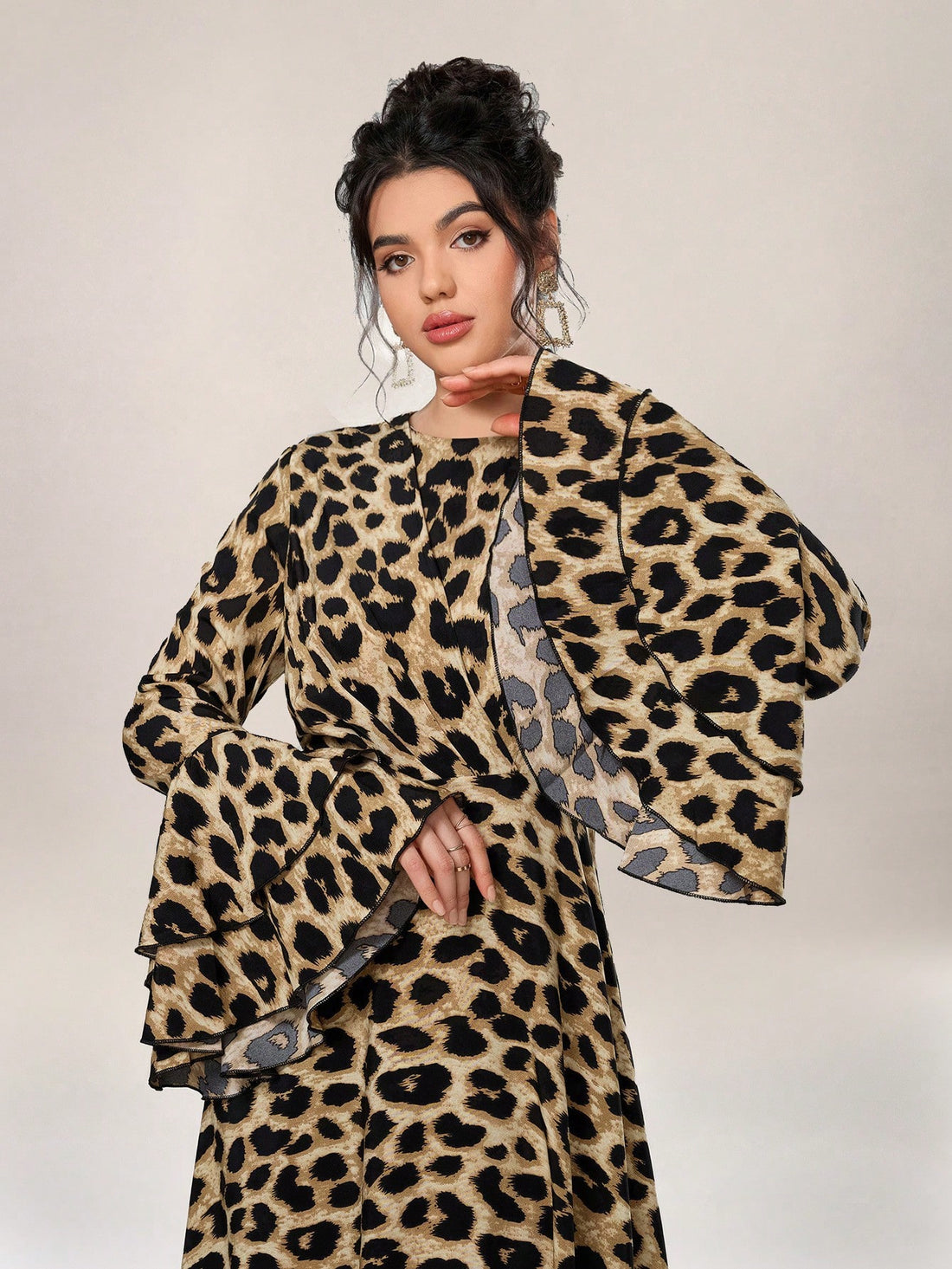 Introducing Wildly Chic: Women's Leopard Print Flared Sleeve Dress. Made with high-quality material, this dress features a trendy leopard print and flared sleeves for a bold and stylish look. Perfect for any occasion, this dress will make you stand out in the crowd. Add a touch of wild to your wardrobe with Wildly Chic.