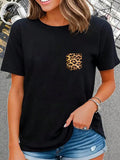 Show off your wild side with our Wildly Stylish: Leopard Print Pocket Tee! This playful and quirky tee is perfect for any animal lover, with its eye-catching leopard print pocket. Add a touch of fun and fashion to your wardrobe with this unique tee.