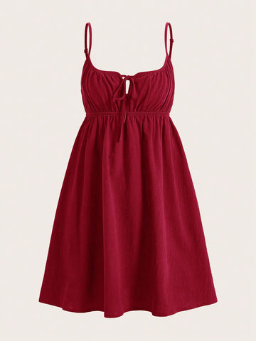 Turn heads with this playful Wine Red Woven Front Tie Casual Slip Dress. Its vibrant hue and charming front tie detail add a flirty touch, while the lightweight woven fabric keeps you comfy all day. Perfect for effortless style whether you're out with friends or enjoying a sunny day.