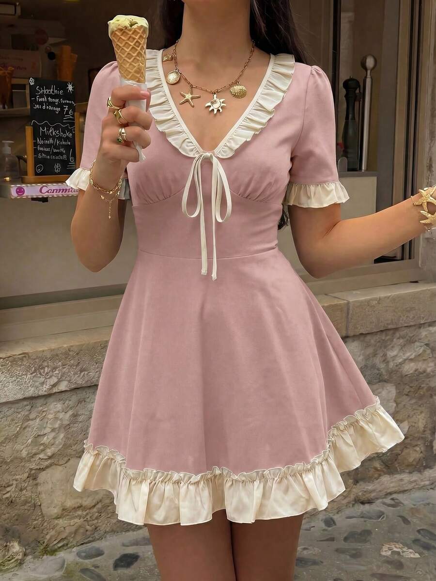 Dusty pink ruffle tie-front skater mini dress in front café detail view