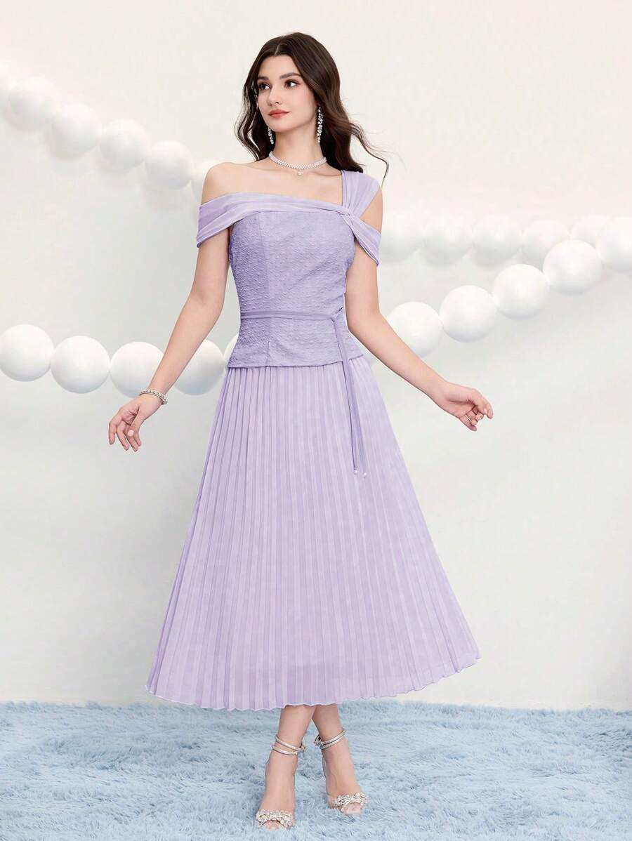 Step into the spotlight in this stunning jacquard dress designed for your most memorable moments. The gathered waist creates a flattering silhouette while delicate pleats add movement and dimension throughout. Crafted from luxurious jacquard fabric, this elegant piece transitions seamlessly from cocktail hour to prom night. Whether you're celebrating a special occasion or turning heads at a formal event, this dress delivers sophistication with a touch of playful charm. Perfect for anyone ready to make an un