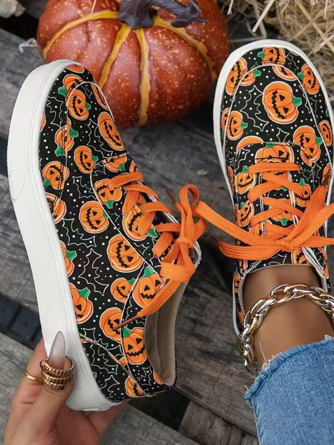These Women Plus Size Pumpkin & Skull Printed Casual Lace-Up Sneakers are perfect for the fall and spring seasons. Their casual lace-up design makes them easy to wear, while the pumpkin and skull print adds a fun touch. With a range of sizes available, these sneakers are sure to be a comfortable and stylish addition to any wardrobe.
