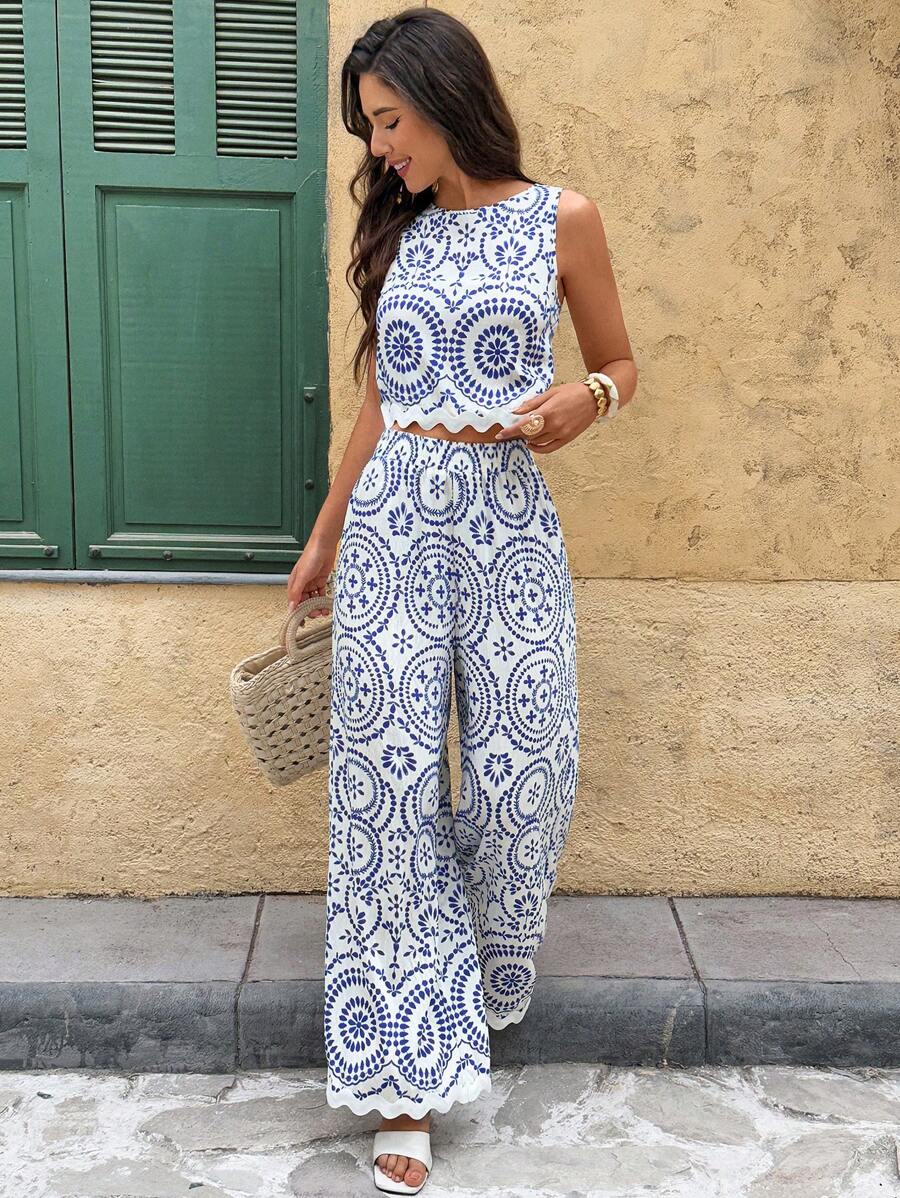 Embrace effortless summer style with this chic 2-piece set featuring a sleeveless crop top with round neckline and contrasting botanical print, paired with relaxed wide-leg pants. Crafted from a breathable viscose and polyamide blend, this boho ensemble transitions seamlessly from beach days to vacation getaways. The loose fit offers comfort and movement, while the zippered and buttoned details add practical appeal. Machine wash with gentle detergent for easy care. Perfect for creating laid-back, resort-rea
