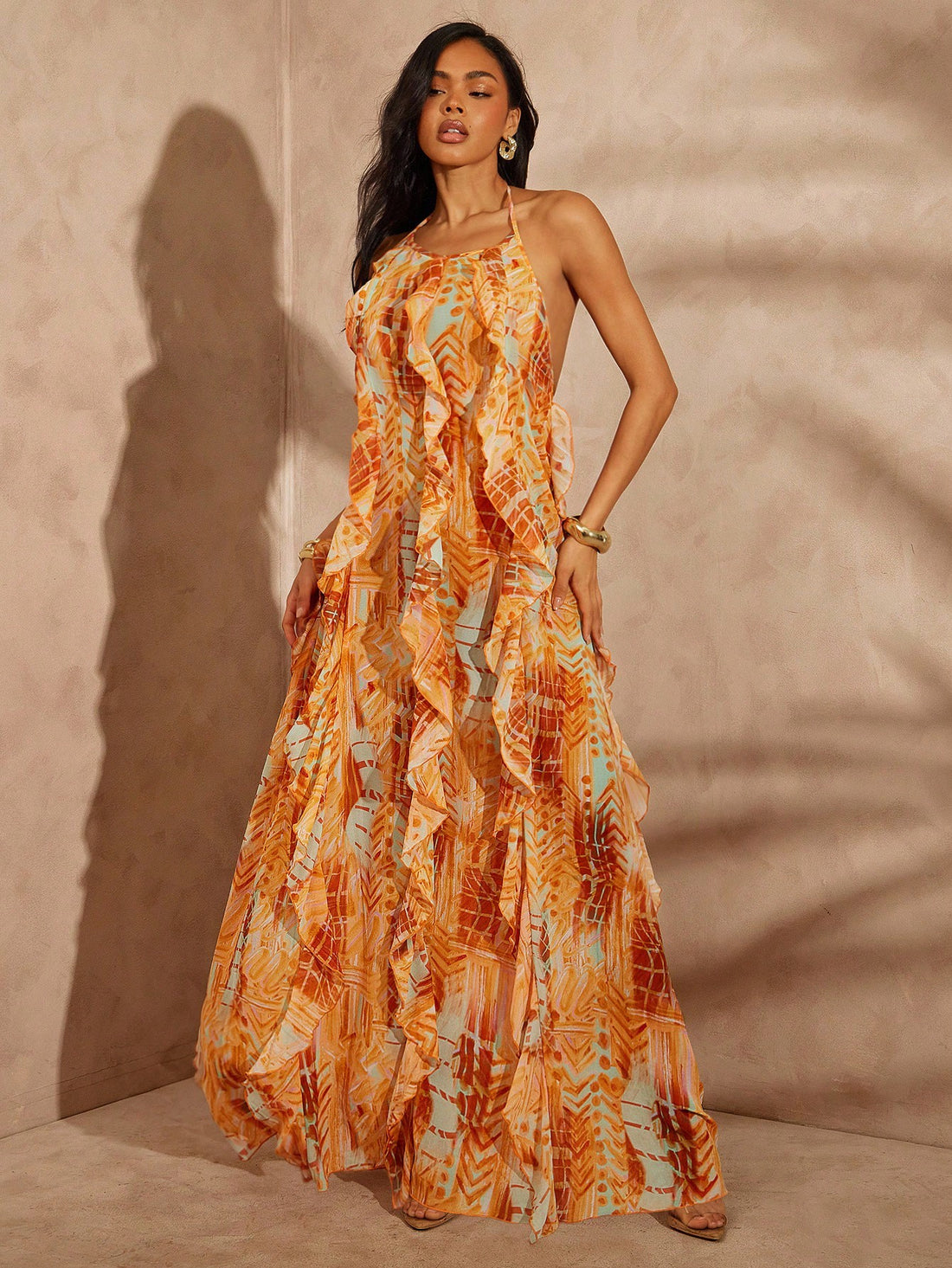 Step into vibrant style with this Women's Abstract Check Mixed Print Maxi Dress. Featuring a playful blend of prints, a flirty layered ruffle hem, and a chic halter neck design, it’s perfect for turning heads at any summer gathering. Comfortable and eye-catching, this dress effortlessly combines fun patterns with a breezy silhouette for all-day confidence.