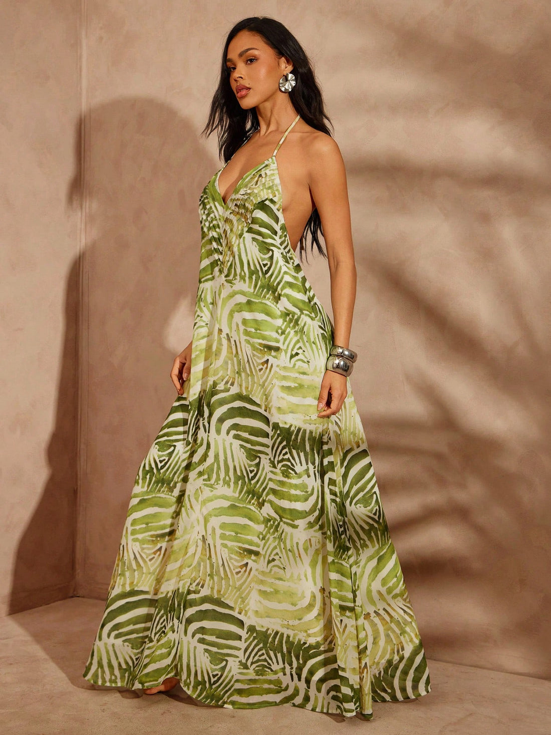 Step into summer with effortless charm in this Women's Adjustable Tie Halter Maxi Dress. Featuring a playful abstract check print, its adjustable halter ties let you customize the fit for all-day comfort. The flowing maxi silhouette is perfect for sunny beach days or lively vacation strolls, keeping you cool and stylish wherever you go. Embrace your fun side with a dress that’s as vibrant as your adventures!