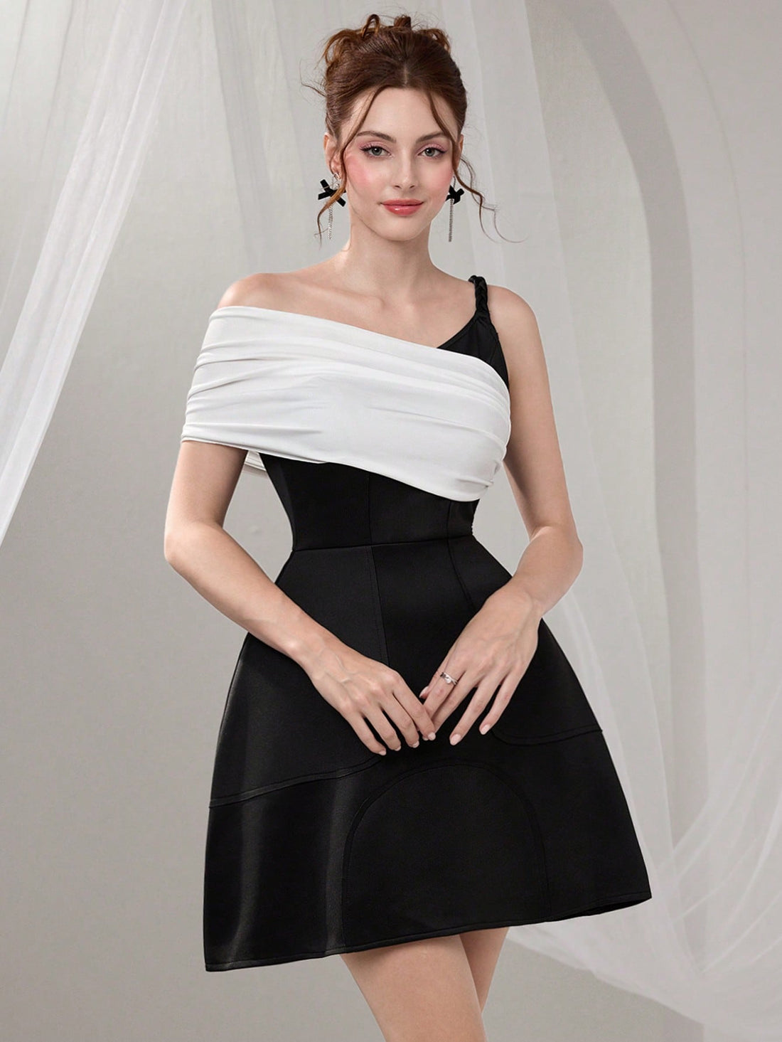 Make a statement at your next special occasion in this stunning asymmetric neckline maxi dress! Delicate beaded embellishments catch the light beautifully, adding just the right amount of sparkle without overwhelming your look. The flowing maxi silhouette flatters every figure while the unique neckline design ensures you'll stand out from the crowd. Whether you're walking across the graduation stage or dancing the night away at a formal event, this dress delivers elegance with a fun, fashion-forward twist. 