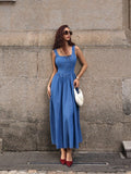 Turn heads in this daring denim dress that flips the script on classic style. The backless silhouette paired with a charming bow tie detail creates an effortlessly chic vibe—perfect for those who love a little flirtation with fashion. Sleeveless and long, it's your go-to for making a statement at summer events, casual outings, or whenever you want to feel confidently fabulous. Dress it up with heels or keep it cool with sneakers—this versatile piece does it all.