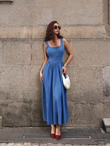 Turn heads in this daring denim dress that flips the script on classic style. The backless silhouette paired with a charming bow tie detail creates an effortlessly chic vibe—perfect for those who love a little flirtation with fashion. Sleeveless and long, it's your go-to for making a statement at summer events, casual outings, or whenever you want to feel confidently fabulous. Dress it up with heels or keep it cool with sneakers—this versatile piece does it all.