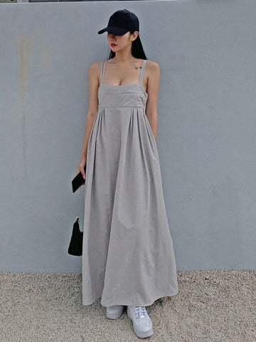 Effortlessly elegant and comfortable, this Women's Backless Long Cami Dress is a must-have for any wardrobe. With built-in bust support, you can confidently wear this backless dress without the hassle of a bra. Perfect for any occasion, this dress combines style and practicality for a truly effortless look.