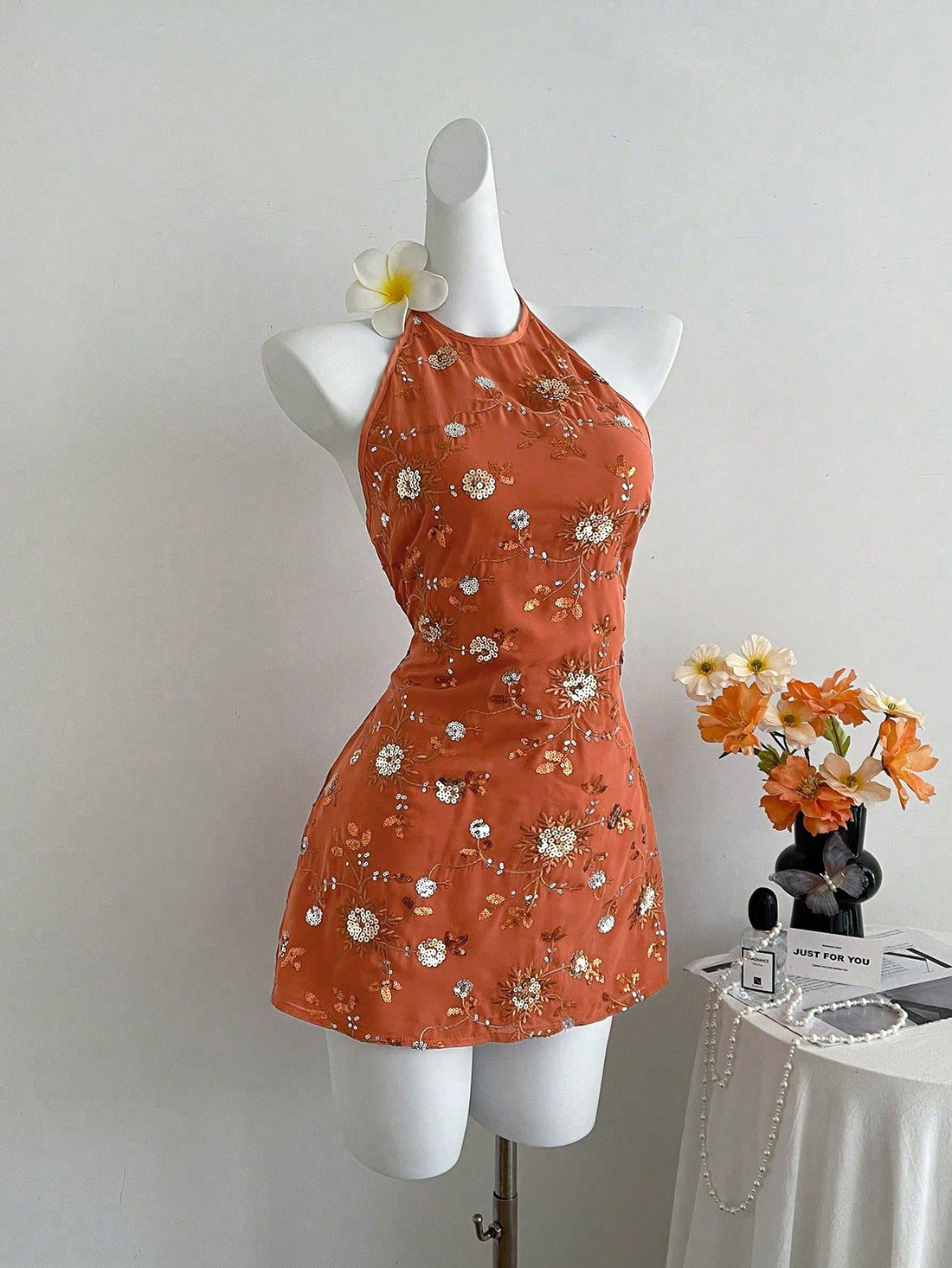 Turn heads this summer with our Women's Beaded Halter Mini Dress, designed for effortless beach vacation vibes. Its sparkling beadwork adds a touch of fun and glamour, while the halter neckline keeps you cool and stylish under the sun. Lightweight and flirty, this mini dress is your go-to for seaside strolls or sunset parties. Embrace the playful spirit of summer in a dress that’s as lively as your adventures!