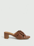 Step into effortless charm with these brown open-toe sandals designed to turn heads. The sturdy thick French heel adds a chic lift while keeping comfort front and center. A stylish square buckle brings a playful twist, making these sandals perfect for sunny days and lively nights alike.