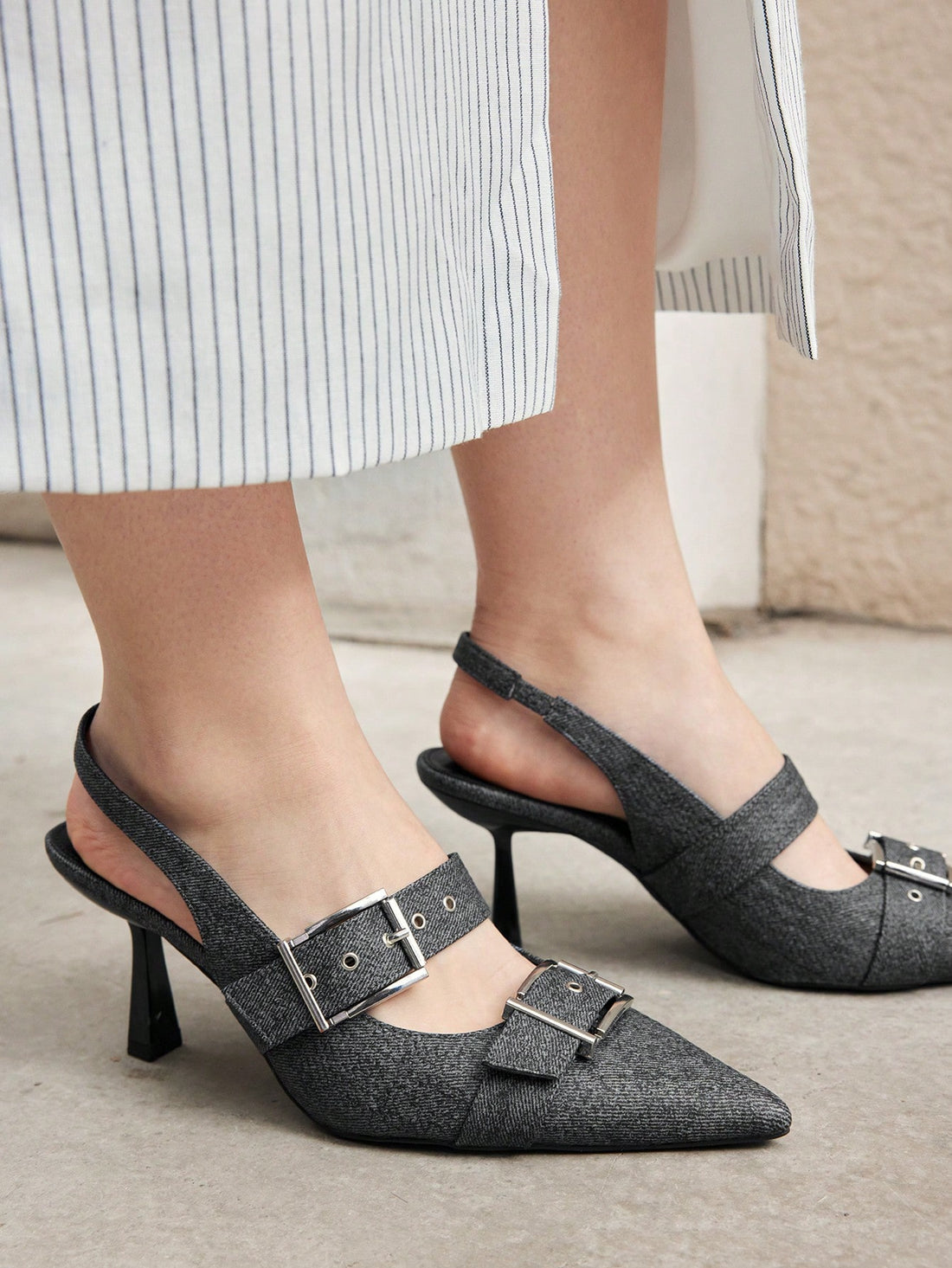 Elevate your summer style with our Women's Buckle Detail High Heels. Perfect for vacation, these heels add a touch of elegance and sophistication to any outfit. With adjustable buckle details and a sturdy heel, you'll feel confident and fashionable all day. Don't miss out on our summer sale!