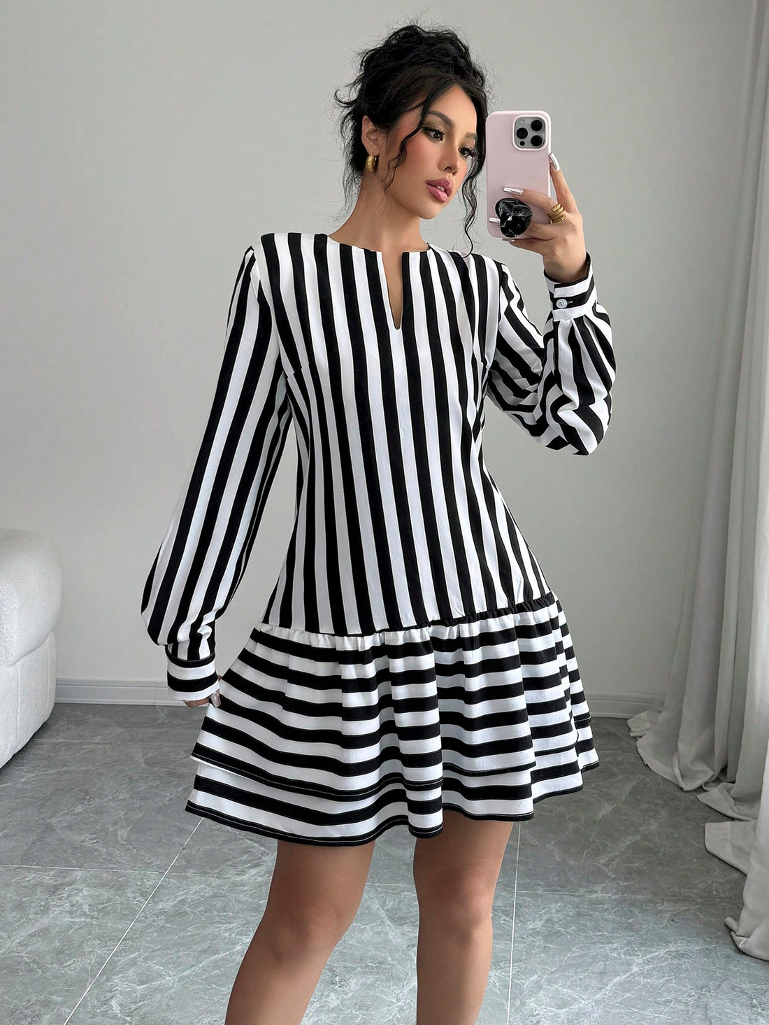 Step out in style with this playful women's casual striped mini dress. Featuring a flirty cutout neckline and charming lantern sleeves, it effortlessly combines comfort and fun. The breezy fit and classic stripes make it perfect for anything from weekend brunch to spontaneous adventures. Add a dash of whimsy to your wardrobe with this easy-to-wear dress that’s ready to brighten your day.