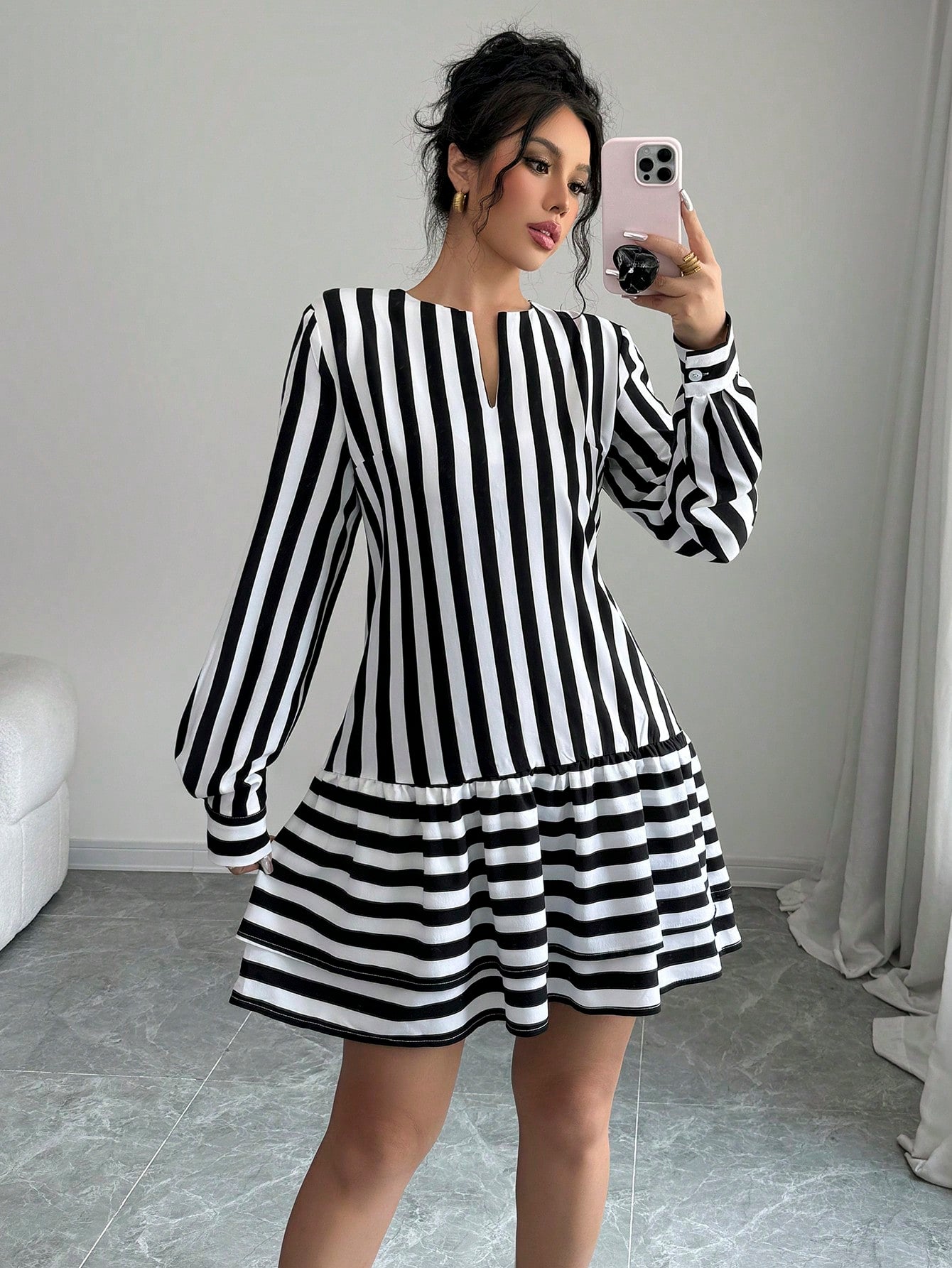 Step out in style with this playful women's casual striped mini dress. Featuring a flirty cutout neckline and charming lantern sleeves, it effortlessly combines comfort and fun. The breezy fit and classic stripes make it perfect for anything from weekend brunch to spontaneous adventures. Add a dash of whimsy to your wardrobe with this easy-to-wear dress that’s ready to brighten your day.
