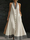 Cream halter maxi dress front view with gingham trim buttons and pocket
