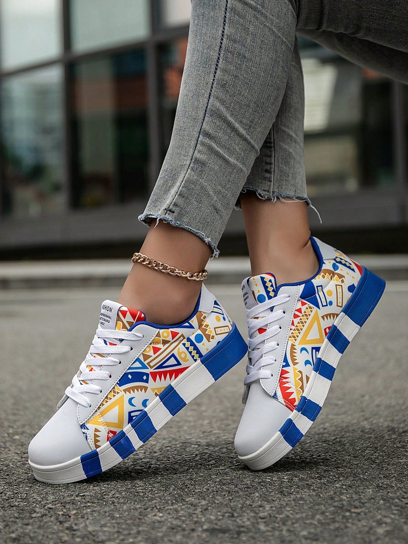 Introducing our Women's Colorblock Graffiti Lace Up Sneakers - the perfect blend of fashion and function. These lightweight sneakers feature a trendy color block design and graffiti accents, making them a stylish addition to any outfit. With a comfortable lace-up closure, these sneakers are both fashionable and practical for everyday wear.