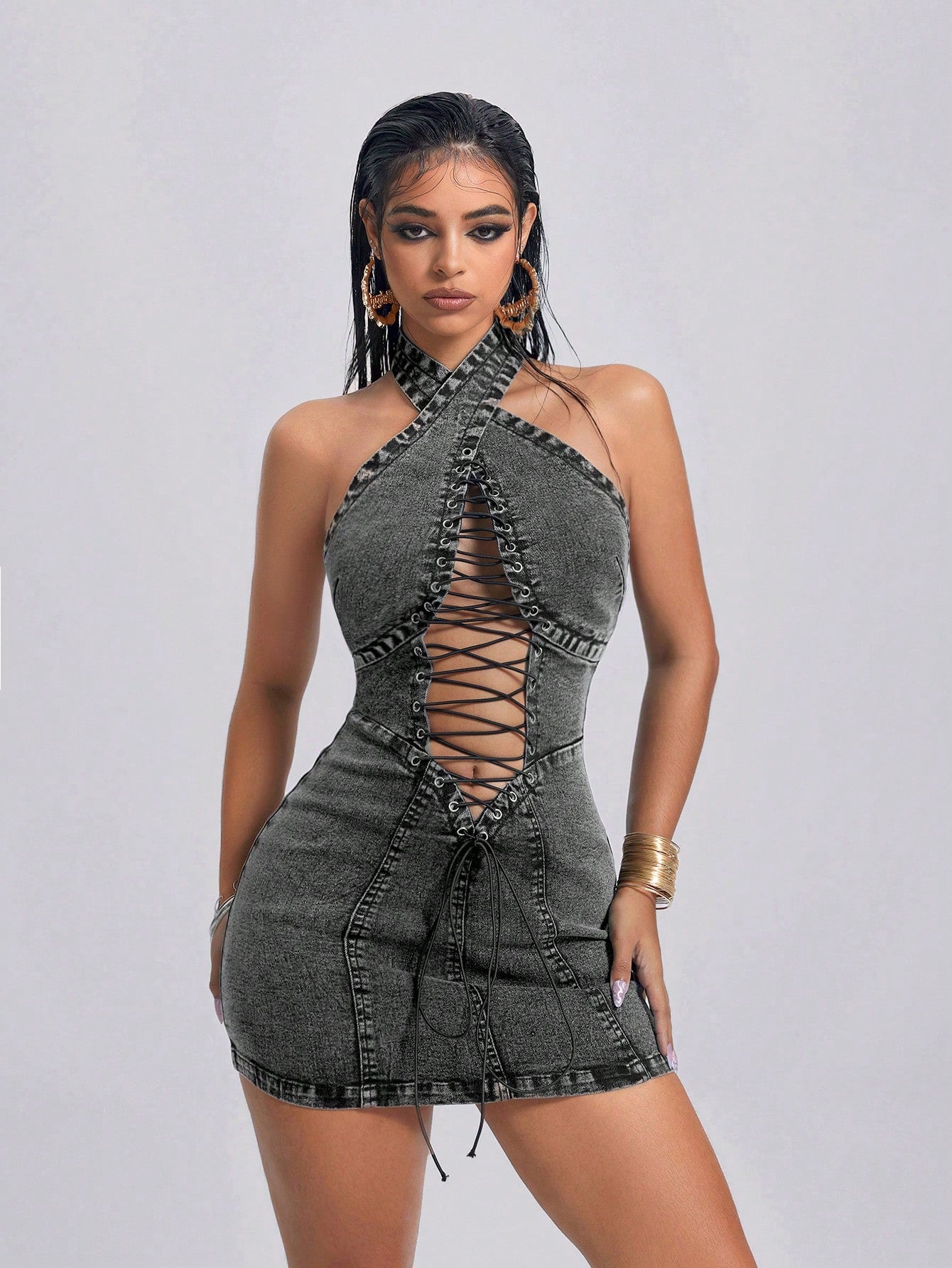 Introducing our Women's Criss-Cross Halter Neck Fitted Cutout Denim Dress! This dress features a unique halter neck design and cutout details for a modern and chic look. Made with high-quality denim fabric, it offers a comfortable and flattering fit for any body type. Upgrade your wardrobe with this stylish dress now!
