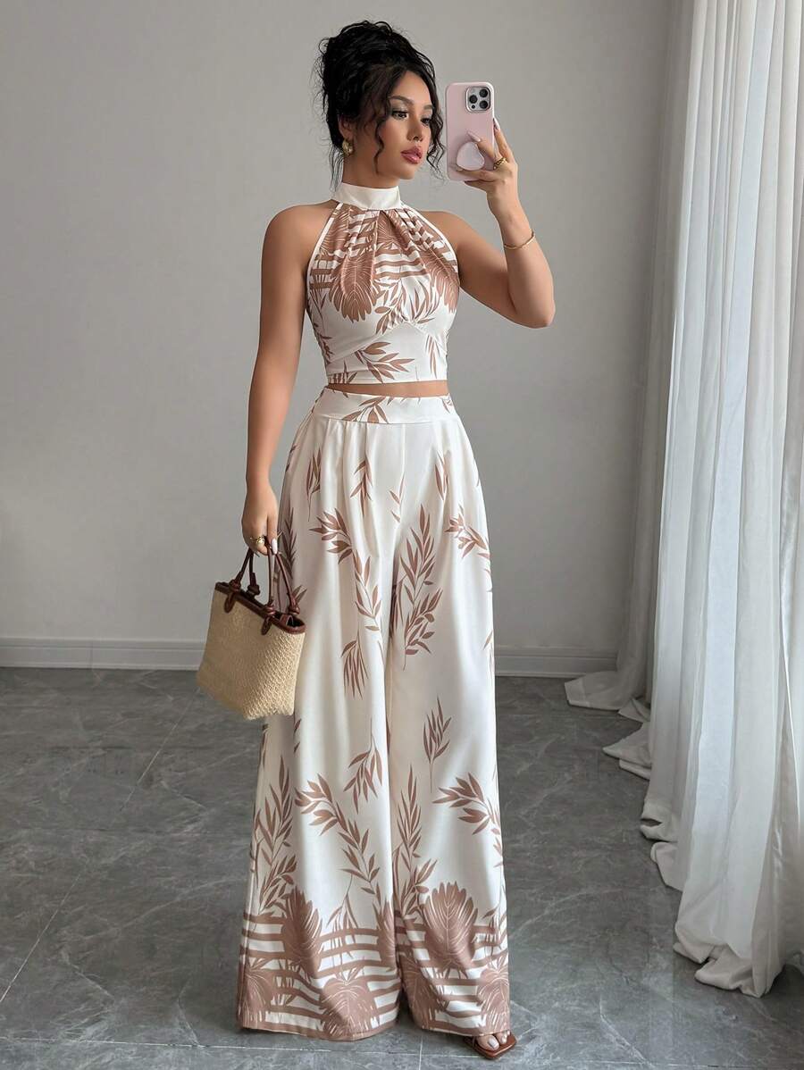 Effortless elegance meets vacation comfort in this stunning 2-piece set. The halter neck top features a flattering silhouette that's perfect for resort dinners and beachside strolls, while the wide-leg pants offer breathable ease and sophisticated style. Lightweight fabric keeps you cool in warm climates, and the coordinated design means less packing and more confidence. Ideal for getaways, weekend escapes, or elevated casual wear.