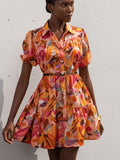 This playful short dress boasts a one-of-a-kind print that turns heads wherever you go! Slip into instant elegance with its flattering silhouette, perfect for beach strolls or sunset cocktails. Pack this versatile vacation essential and be ready for any adventure – from sightseeing to impromptu dinner dates!